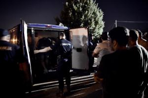 Serbian police officers detain migrants for having&nbsp;&hellip;