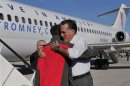 Republican presidential nominee Romney greets vice presidential nominee Ryan after arriving in Columbus, Ohio