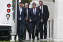 Republican senators, from left, Ted Cruz of Texas, John McCain of Arizona, David Vitter of Louisiana, and Richard Shelby of Alabama, walk in the rain back to their bus at the North Portico of the White House in Washington, Friday, Oct. 11, 2013, after they met with President Barack Obama regarding the government shutdown and debt ceiling. After weeks of ultimatums, President Barack Obama and congressional Republicans are exploring whether they can end a budget standoff that has triggered a partial government shutdown and edged Washington to the verge of a historic, economy-jarring federal default. (AP Photo/Charles Dharapak)(AP Photo/Charles Dharapak)