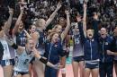 United States' team celebrates after winning the women's Volleyball World Championships final match against China in Milan, Italy, Sunday, Oct. 12, 2014. (AP Photo/Emilio Andreoli)
