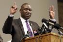 FILE - In this Monday, Aug. 18, 2014, file photo, Brown family attorney Benjamin Crump speaks during a news conference in St. Louis County, Mo. Legal experts say a cellphone video that shows a witness raising his hands in the air immediately after the fatal shooting of Michael Brown in Ferguson appears to support previous accounts and could bolster arguments that Brown was surrendering when he was shot. Crump said the video is "the best evidence you can have other than a video of the actual shooting itself." (AP Photo/Jeff Roberson, File)