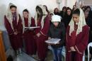 Syrians attend mass at a church in Sadad, a majority Syriac Orthodox Christian ancient town which is believed to be the same town referred to as Zedad in the Old Testament's 'Book of Kings'
