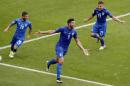 Italy's Graziano Pelle, center, celebrates after scoring his side's second goal during the Euro 2016 round of 16 soccer match between Italy and Spain, at the Stade de France, in Saint-Denis, north of Paris, Monday, June 27, 2016. (AP Photo/Francois Mori)