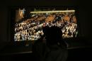 A photographer works as members of the UN General Assembly prepare to vote in a secret ballot to fill five non-permanent seats on the Security Council on October 16, 2014 in New York