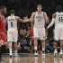 Brooklyn Nets' Williams, Lopez and Wallace tap hands as Chicago Bulls' Robinson walks off the court in the fourth quarter of their NBA basketball playoff game in New York