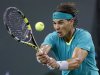 Nadal of Spain returns a shot against Federer of Switzerland during their men's singles quarterfinal match at the BNP Paribas Open ATP tennis tournament in Indian Wells