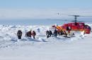 In this image provided by Australasian Antarctic Expedition, passengers trapped for more than a week on the icebound Russian research ship MV Akademik Shokalskiyin are rescued by a Chinese helicopter Thursday, Jan. 2, 2014. The helicopter rescued all 52 passengers from the research ship that has been trapped in Antarctic ice, 1,500 nautical miles south of Hobart, Australia, since Christmas Eve after weather conditions finally cleared enough for the operation Thursday. (AP Photo/Australasian Antarctic Expedition, Jessica Fitzpatrick) EDITORIAL USE ONLY, ONE TIME USE, NO ARCHIVES; NO SALES