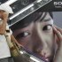 A shopper passes by an advertisement poster of Sony at a store in Tokyo, Thursday, Aug. 2, 2012.  Sony is reporting a bigger loss for the April-June quarter at 24.6 billion yen ($316 million) despite a sales recovery from a disaster-struck previous year. The Japanese electronics and entertainment company said Thursday its income was hurt by a surging yen, which erases overseas earnings, and by declining sales of liquid-crystal display TVs and video game machines. (AP Photo/Koji Sasahara)