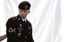 Army Pfc. Bradley Manning is escorted into a courthouse in Fort Meade, Md., Wednesday, June 5, 2013, on the third day of his court martial. Manning is charged with indirectly aiding the enemy by sending troves of classified material to WikiLeaks. He faces up to life in prison. (AP Photo/Patrick Semansky)