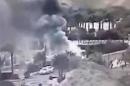 An image made from a video provided by the Israeli Airports Authority shows smoke from the bombing of the bus carrying South Korean sightseers near the tip of the Red Sea's Gulf of Aqaba Sunday Feb. 16, 2014. At least three South Korean tourists were killed and 12 seriously wounded, according to Egyptian security officials. (AP Photo/Israeli Airports Authority)