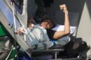 Brazil's Neymar lies inside a medical helicopter at the Granja Comary training center, in Teresopolis, Brazil, Saturday, July 5, 2014. Neymar was airlifted from Brazil's training camp Saturday and will be treated at home for his back injury. Neymar, the biggest football star in Brazil, was ruled out of the rest of the World Cup after fracturing his third vertebra during Friday's 2-1 quarterfinal win over Colombia. (AP Photo/Leo Correa)