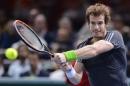 Britain's Andy Murray returns the ball to France's Julien Benneteau on October 29, 2014 during their second-round match of the ATP World Tour Masters 1000 indoor tennis tournament in Paris