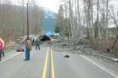 This photo provided by the Washington State Patrol shows the aftermath of a mudslide that moved a house with people inside in Snohomish County on Saturday March 22, 2014. The Washington Department of Transportation says mud, trees and building materials are blocking both directions of State Route 530 near the town of Oso. Search and rescue operations are underway by Snohomish County crews and the Washington State Patrol. Spokesman Bart Treece of the Washington State Department of Transportation says he doesn't know how long the two-lane rural road will be closed. He says drivers are advised to find another way to get between Darrington and Arlington. (AP Photo/Washington State Patrol)