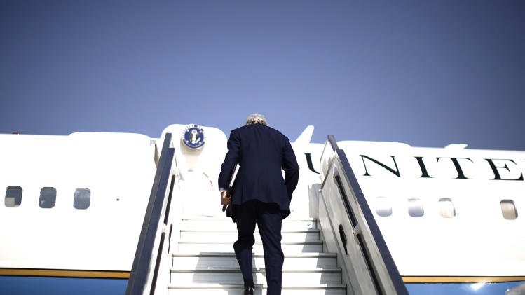 U.S. Secretary of State John Kerry steps aboard his aircraft en route to Geneva after meeting with Israeli Prime Minister Benjamin Netanyahu in Tel Aviv, Israel, Friday, Nov. 8, 2013. Netanyahu, before meeting with Kerry, said Friday that he "utterly rejects" the emerging nuclear deal between western powers and Iran, calling it a "bad deal" and promising that Israel will do everything it needs to do to defend itself. (AP Photo/Jason Reed, Pool)
