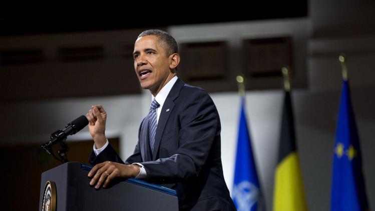 President Barack Obama speaks at the Palais des Beaux-Arts, Wednesday, March 26, 2014, in Brussels, Belgium. Obama is on a one day trip to Belgium to shore up commitments he received from allies in The Hague, Netherlands, to reassure Eastern Europeans members of NATO that the alliance will stand by them and to make a larger point about European security a quarter-century after the fall of the Iron Curtain. (AP Photo/Pablo Martinez Monsivais)