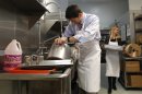 Republican vice presidential candidate, Rep. Paul Ryan, R-Wis., and his wife Janna wash pots at St. Vincent DePaul dinning hall, Saturday, Oct. 13, 2012, in Youngstown, Ohio. (AP Photo/Mary Altaffer)