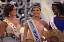 Newly crowned Miss World, Megan Young of Philippines, center, with second runner-up Miss France Marine Lorpheline, left, and third runner-up Miss Ghana Carranza Naa Okailey Shooter, smile after they winning the Miss World contest in Nusa Dua, Bali, Indonesia, Saturday, Sept. 28, 2013. (AP Photo/Firdia Lisnawati)
