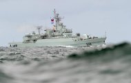 A Chinese naval frigate steams through the swell as it approaches Sydney Harbour in 2010. Chinese President Hu Jintao has urged the country's navy to prepare for military combat and advance naval modernisation as part of efforts to safeguard world peace. (AFP Photo/Torsten Blackwood)