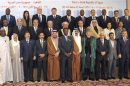 Egyptian President Mohamed Mursi stands with other leaders of Islamic nations for a group photo before the opening of the OIC summit in Cairo