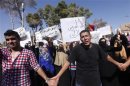 Protesters from Bani Walid shout slogans during a demonstration against the decision of the National Congress besieging the city of Bani Walid, in front of the National Congress in Tripoli