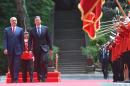 Albanian Prime Minister Edi Rama (L) and Serbian counterpart Aleksandar Vucic (R) walk during a welcoming ceremony outside the Palace of Brigades in Tirana on May 27, 2015