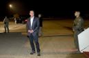 U.S. Defense Secretary Carter pauses on tarmac as he boards his plane en route to Tel Aviv in Andrews Air Force Base