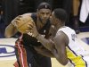 Miami Heat's LeBron James, left, gets close defense from Indiana Pacers' Lance Stephenson during the first half of Game 4 of the NBA basketball Eastern Conference finals, Tuesday, May 28, 2013, in Indianapolis. (AP Photo/AJ Mast)