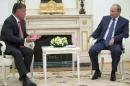 Jordan's King Abdullah speaks with Russian President Putin during their meeting at Kremlin in Moscow