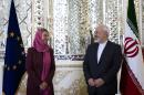Iranian Foreign Minister Mohammad Javad Zarif (R) and EU foreign policy chief Federica Mogherini pose for a picture ahead of a joint news conference in the capital Tehran on July 28, 2015