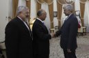 Iran's top nuclear negotiator, Saeed Jalili, right, welcomes International Atomic Energy Agency (IAEA) chief Yukiya Amano, center, for their meeting, as Iran's chief delegate to the IAEA Ali Asghar Soltanieh looks on, in Tehran, Iran, Monday, 21, 2012. The head of the U.N. nuclear agency arrived Monday in Tehran on a key mission that could lead to the resumption of probes by the watchdog on whether Iran has secretly worked on an atomic weapon. It would also strength the Islamic Republic's negotiating hand in crucial nuclear talks with six world powers later this week in Baghdad. (AP Photo/IRNA,Adel Pazzyar)
