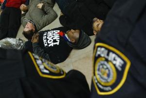 New York Police Department officers watch demonstrators &hellip;