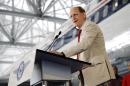 FILE - In this June 17, 2014 file photo, Delta Air Lines CEO Richard Anderson speaks at the grand opening of the new Delta Flight Museum in Atlanta. A recent comment from Anderson about 9/11 has escalated a dispute between U.S. airlines and fast-growing Persian Gulf competitors. (AP Photo/David Goldman, File)
