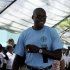 U.S. Olympic gold medalist Lewis arrives at a school in Port-au-Prince