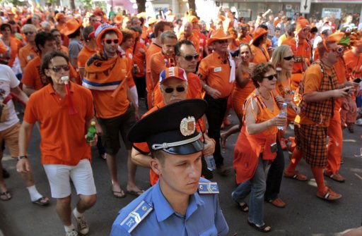 Netherlands soccer fans march to the Metalist stadium for Euro 2012 match in Kharkiv