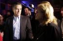 Mitt Romney, the former Republican presidential nominee, left, looks at his wife Ann, right, after speaking during the Republican National Committee's winter meeting aboard the USS Midway Museum Friday, Jan. 16, 2015, in San Diego. (AP Photo/Gregory Bull)