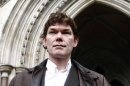 File photograph shows computer hacker Gary McKinnon posing after arriving at the High Court in London