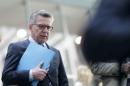German Interior Minister de Maizere leaves a news conference in Berlin