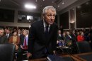 Former Sen. Chuck Hagel sits down before giving testimony to the Senate Armed Services Committee
