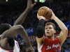 Los Angeles Clippers forward Blake Griffin shoots over Oklahoma City Thunder center Kendrick Perkins in the second quarter of an NBA basketball game in Oklahoma City, Wednesday, Nov. 21, 2012. (AP Photo/Sue Ogrocki)