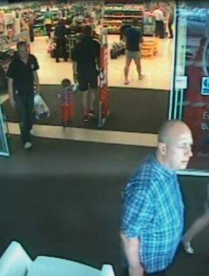 In this image made available by South Wales Police shows a video  image Alan Knight,of Swansea south Wales, right,  in a supermarket in  Bishopís Cleeve in western England in June 2014. Alan Knight a  fraudster who pretended to be quadriplegic and sometimes comatose for two years to avoid prosecution has been convicted after police caught him on camera driving and strolling around supermarkets. Alan Knight of Swansea, Wales, stole more than 40,000 pounds ($64,000) from the bank account of an elderly neighbor with Alzheimer&#39;s disease, prosecutors said. (AP Photo/South Wales Police)