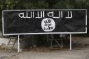 A signpost painted by Boko Haram is seen in the recently retaken town of Damasak