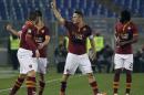 AS Roma's Francesco Totti, center, celebrates with teammates after scoring during a Serie A soccer match between AS Roma and Udinese in Rome's Olympic stadium, Monday, March 17, 2014. (AP Photo/Gregorio Borgia)
