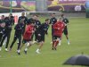 England soccer coach Hodgson warms-up with players during a training session during the Euro 2012 at the Hutnik stadium in Krakow