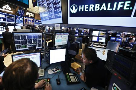 Traders work at the post that trades Herbalife stock on the floor of the New York Stock Exchange in this January 10, 2013 file photograph. REUTERS/Brendan McDermid/Files