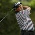 Former champion Angel Cabrera of Argentina hits his tee shot on the second hole during second round play in the 2013 Masters golf tournament in Augusta