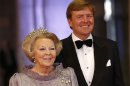 Dutch Queen Beatrix and her son Dutch Crown Prince Willem-Alexander pose for photographers as they arrive for a banquet hosted by the Dutch Royal family at the Rijksmuseum, Amsterdam, The Netherlands, Monday, April 29, 2013. Queen Beatrix has announced she will relinquish the crown on April 30, 2013, after 33 years of reign, leaving the monarchy to her son Crown Prince Willem-Alexander. (AP Photo/Daniel Ochoa de Olza)