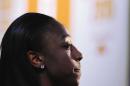 Notre Dame's Jewell Loyd stands off stage before the WNBA basketball draft, Thursday, April 16, 2015, in Uncasville, Conn. Loyd was one of the rare women's basketball players to leave school early to turn pro. (AP Photo/Jessica Hill)