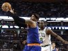 New York Knicks' Carmelo Anthony grabs a pass over Boston Celtics' Jeff Green (8) during the second quarter of Game 3 of a first round NBA basketball playoff series, Friday, April 26, 2013, in Boston. (AP Photo/Winslow Townson)