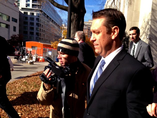 This photo taken with a cellphone shows Rep. Henry "Trey" Radel, R-Fla. leaving court in Washington, Wednesday, Nov. 20, 2013, leaving court after pleading guilty to a misdemeanor charge of cocaine possession and was sentenced to a year's probation. (AP Photo/Jessica Gresko)