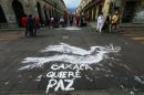 View of a street in downtown Oaxaca, Mexico, reading "Oaxaca wants peace" on June 20, 2016